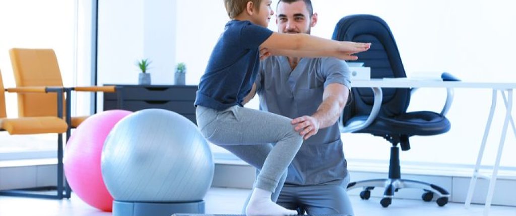 Physical therapist working with a pediatric patient.